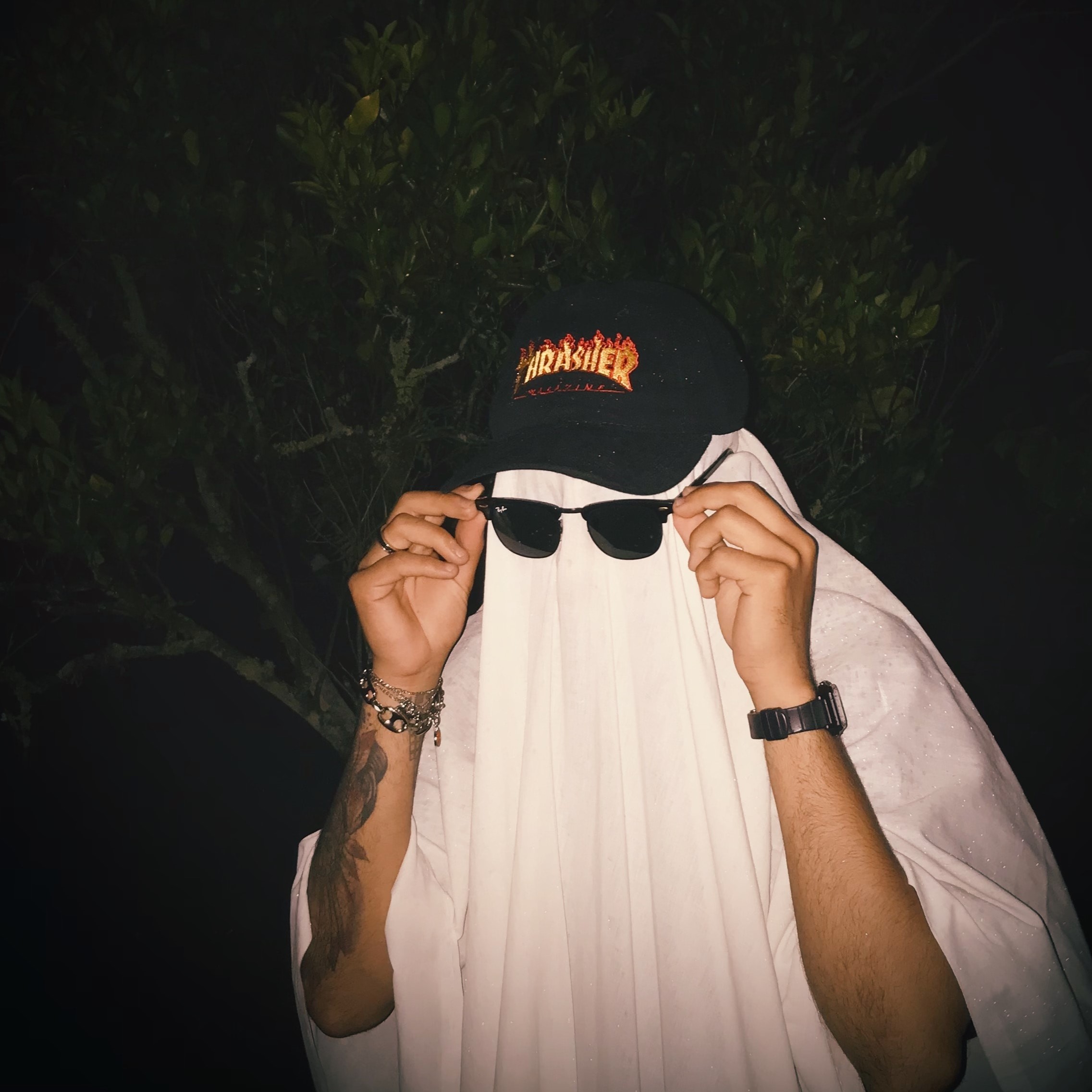 man dressed as ghost with sunglasses